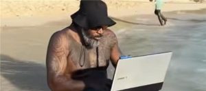 Chris Gayle using his Laptop in water